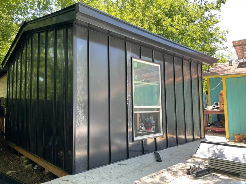 Black standing seam metal wall panels for Roof Inspection in La Follette